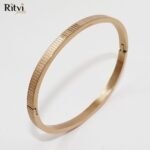 Gold-plated textured kada bracelet for women by Ritvi Jewels