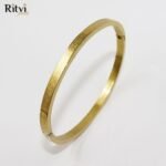 Gold-plated spiral design kada bracelet for women by Ritvi Jewels