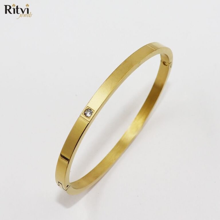 Gold-plated minimalist kada bracelet with solitaire stone accent for women by Ritvi Jewels