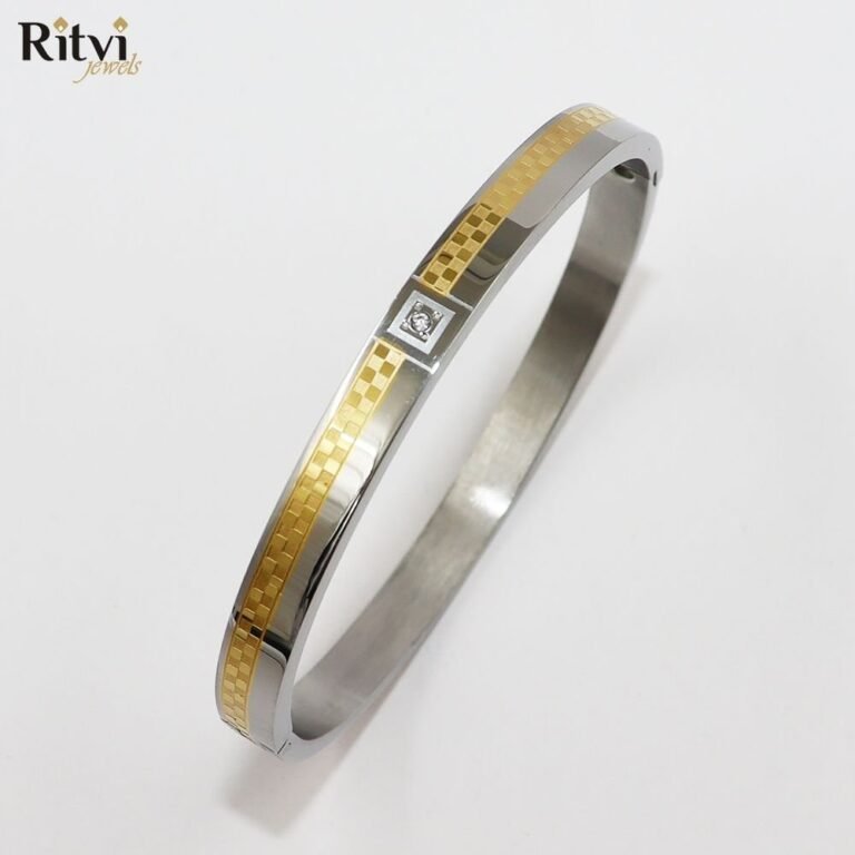 Two-tone gold and silver kada bracelet with stone accent by Ritvi Jewels