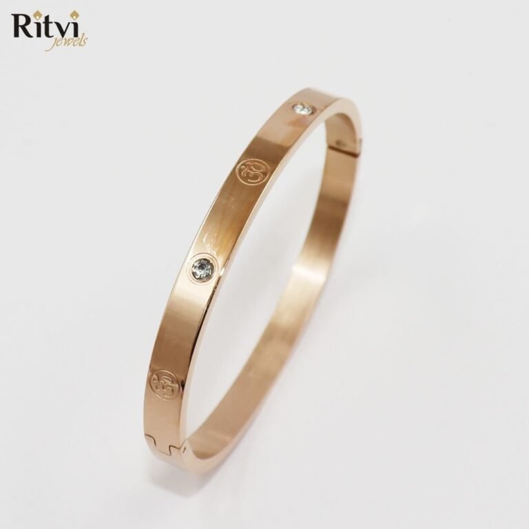 Gold-plated Om symbol kada bracelet with crystal accents for women by Ritvi Jewels