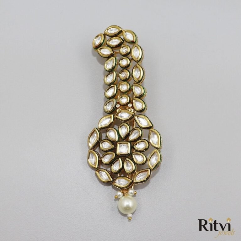 Elegant Kundan groom kalgi with sparkling white stones, intricate gold detailing, floral design and pearl drop for Indian wedding