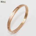 Rose gold-toned elegant bracelet with sleek design and crystal detailing
