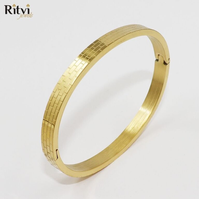 Gold-toned bracelet with elegant textured brick-pattern design