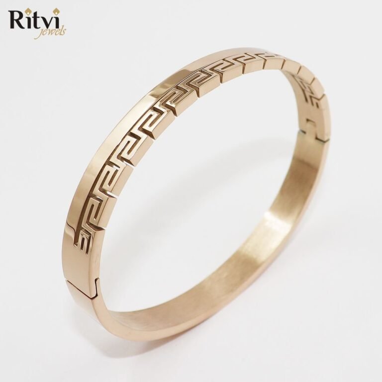 Rose gold-toned bracelet with elegant Greek key geometric pattern design