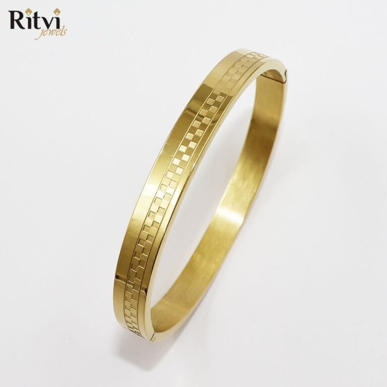 Gold-toned bracelet with sleek design and intricate textured square detailing