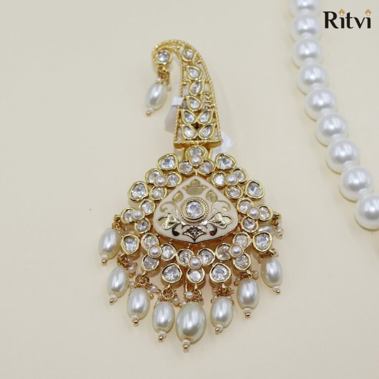 Elegant Kundan groom kalgi with sparkling white stones, intricate gold detailing and pearl drops for Indian wedding