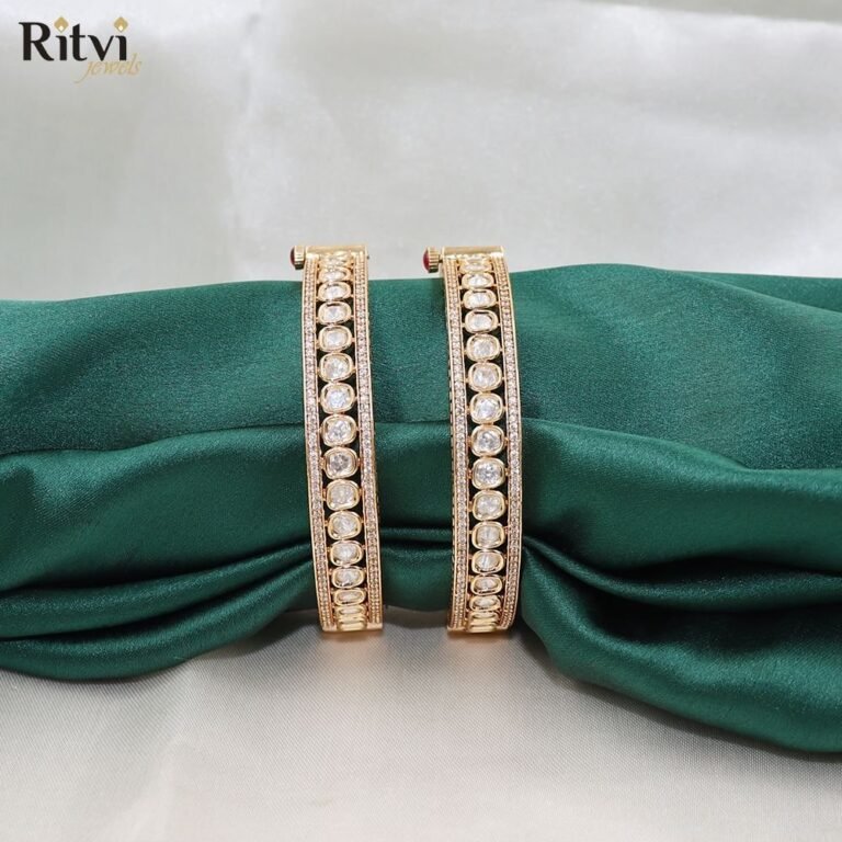 Gold-toned bridal bangles with sparkling round-cut stones and elegant intricate detailing