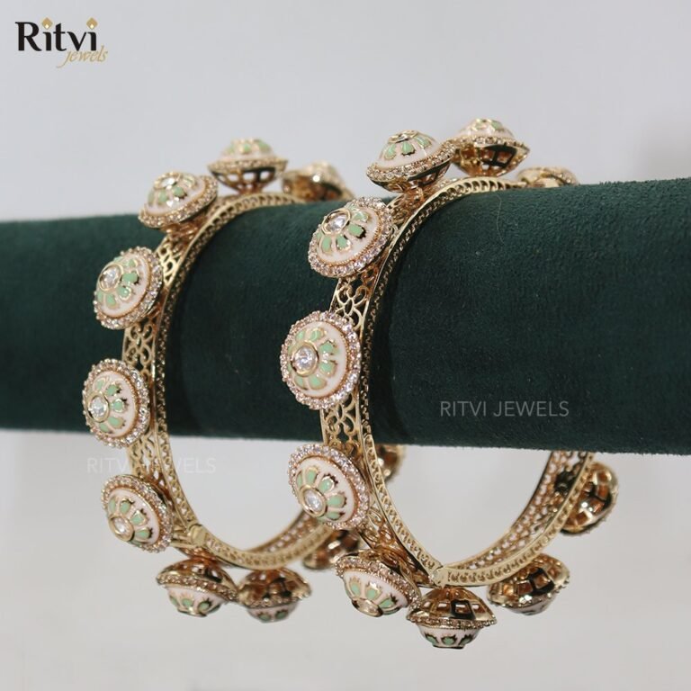 Gold-toned bridal bangles with pastel green and white floral enamel motifs and sparkling stone detailing