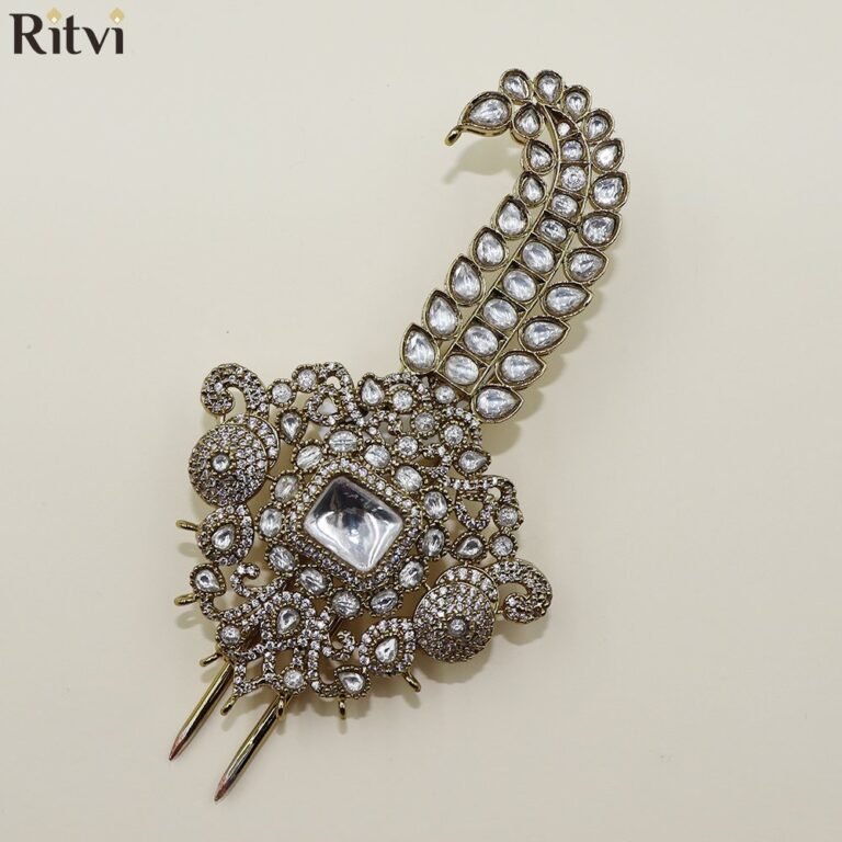 Traditional gold-toned bridal chura accessory with intricate Kundan-style detailing and sparkling stones for a festive wedding look