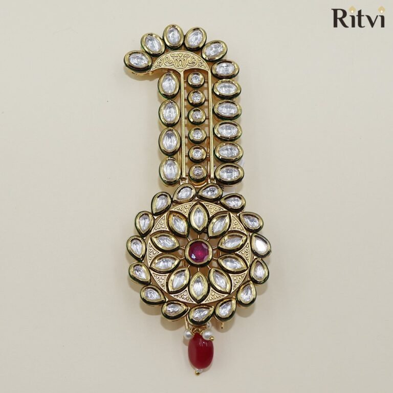 Kundan groom kalgi with red centre gemstone, sparkling white stones, intricate gold detailing and red bead drop for Indian wedding