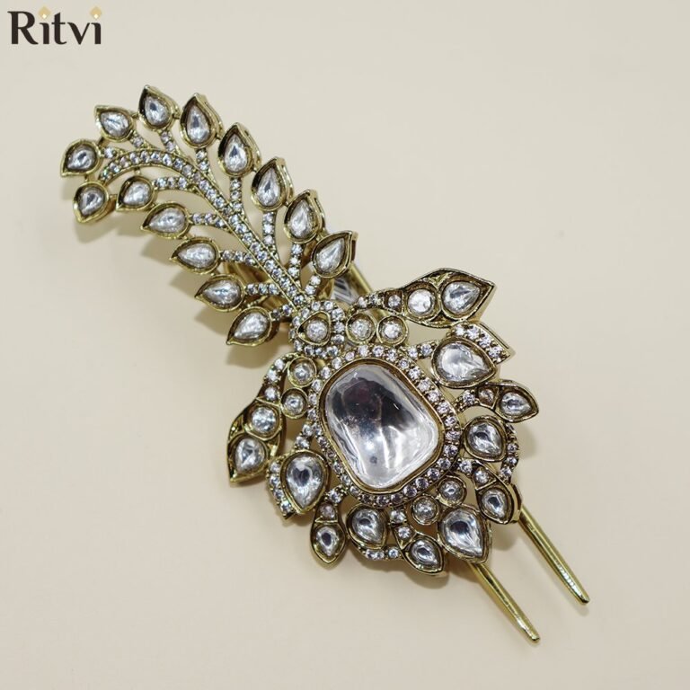 Luxury Kundan groom kalgi with peacock-inspired design, sparkling white stones, intricate gold detailing and central gemstone for Indian wedding