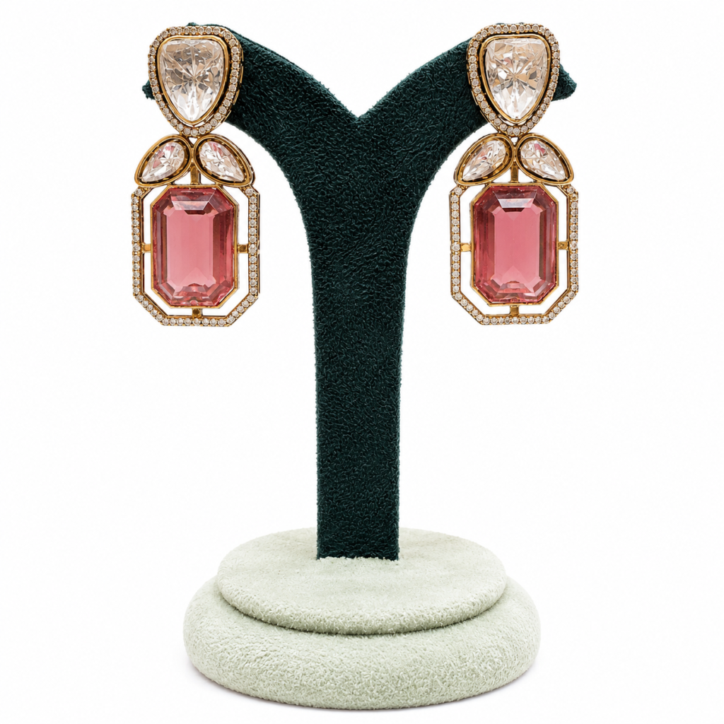 Kaisha gold-plated pink crystal drop earrings with emerald-cut stones, pear-shaped crystals and zircon detailing, elegant statement earrings for weddings, parties and festive wear.