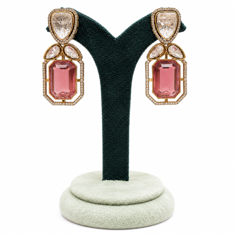 Kaisha gold-plated pink crystal drop earrings with emerald-cut stones, pear-shaped crystals and zircon detailing, elegant statement earrings for weddings, parties and festive wear.
