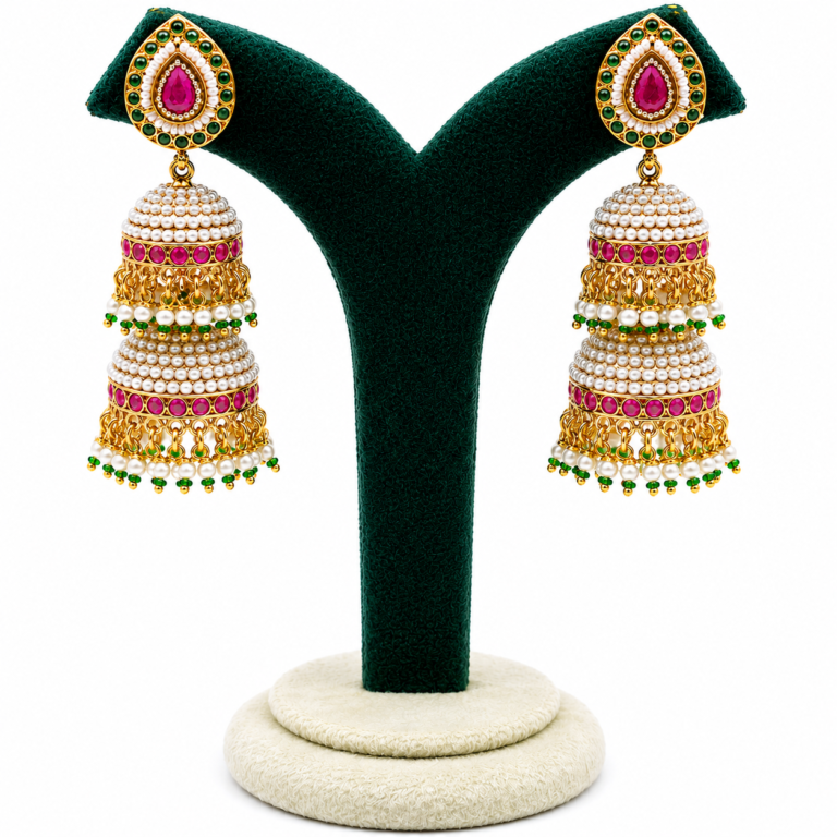 Panchhi gold-plated pearl jhumka earrings with ruby pink and emerald green stones, traditional bridal earrings for weddings, festive and ethnic wear.